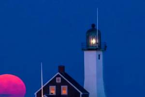 Timelapse Video Shows Harvest Moon Rising Over A Lighthouse.